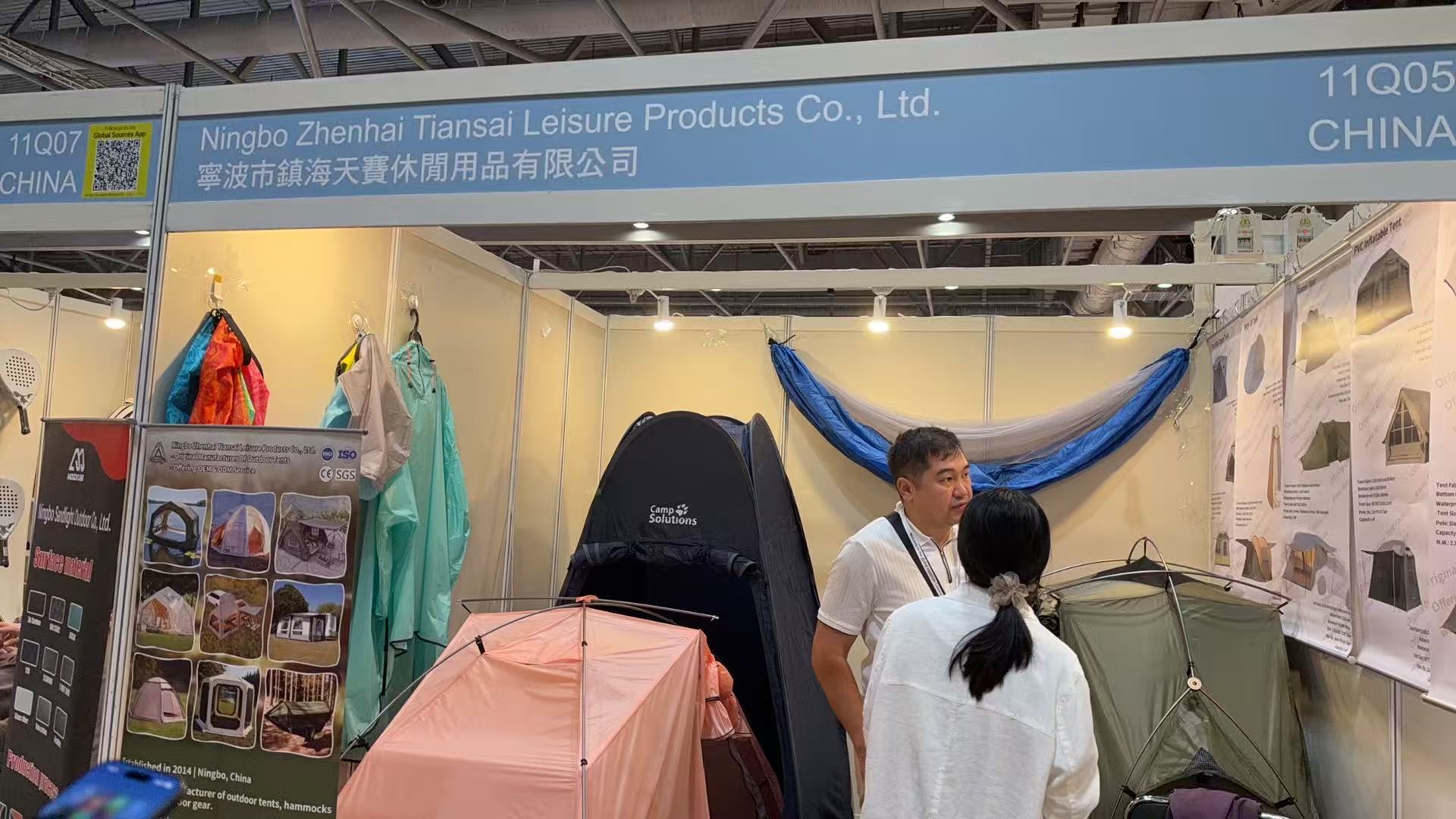 Tenplay booth 11Q05 with assembled tents, product posters and a suspended hammock