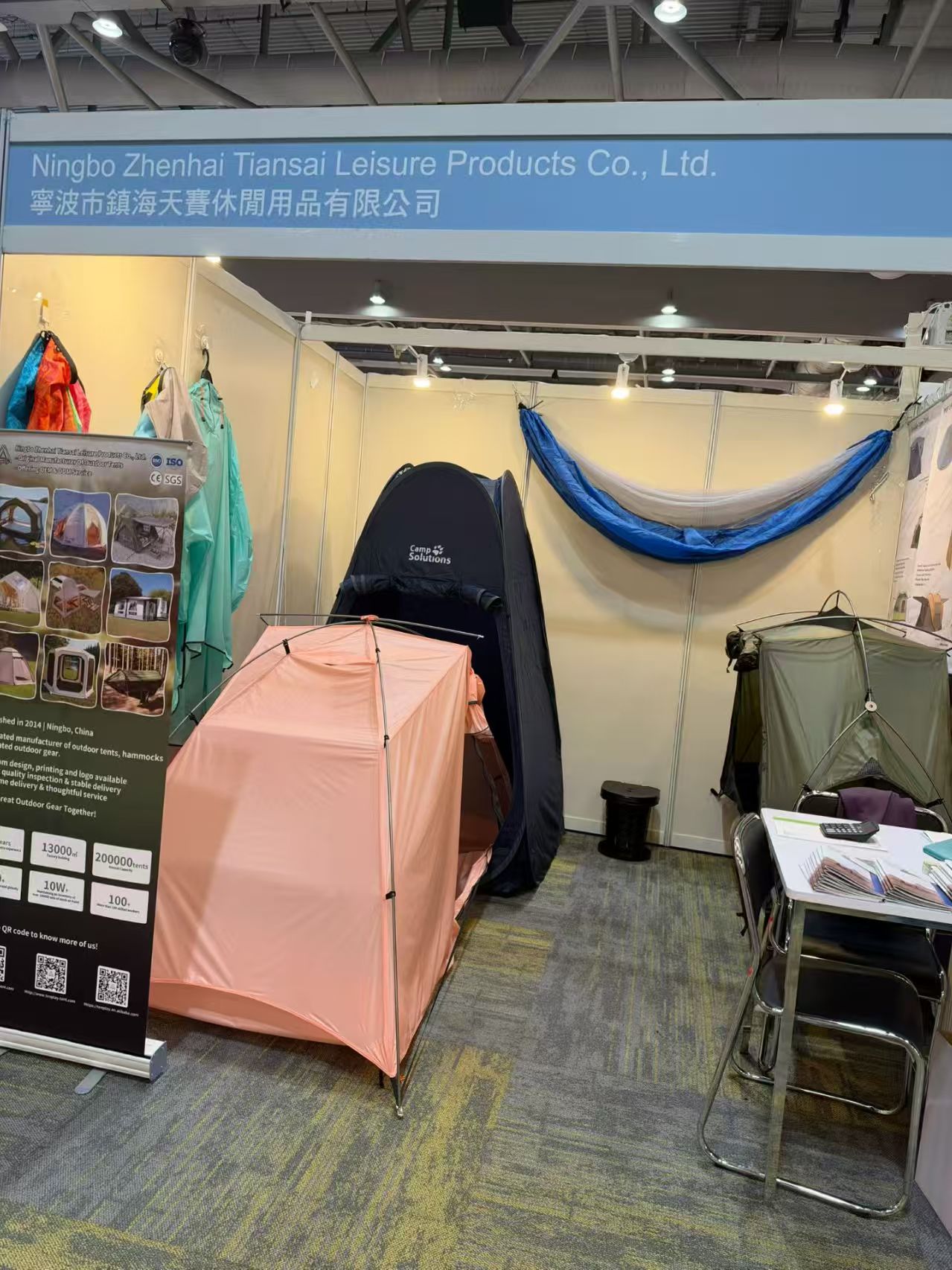 Pink tent, upright shelter and raised tent on display at the Tenplay booth